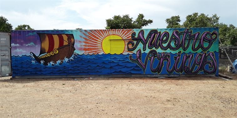 large Storage Container with a Viking ship mural painted on it